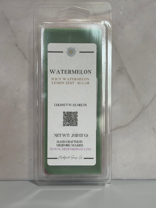 Watermelon scented wax melt package on a gray surface