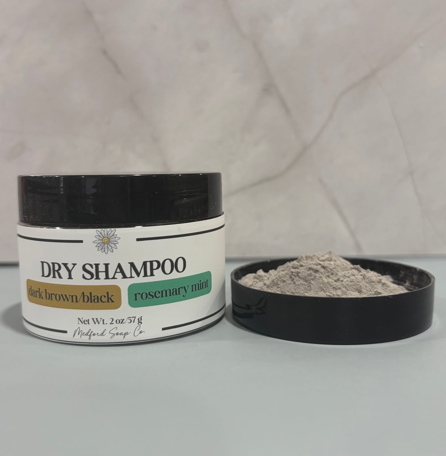 dry shampoo jar with brown powder